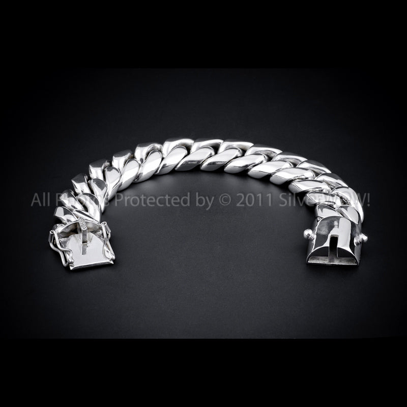 20mm Cuban Link Silver Bracelet curved on black background