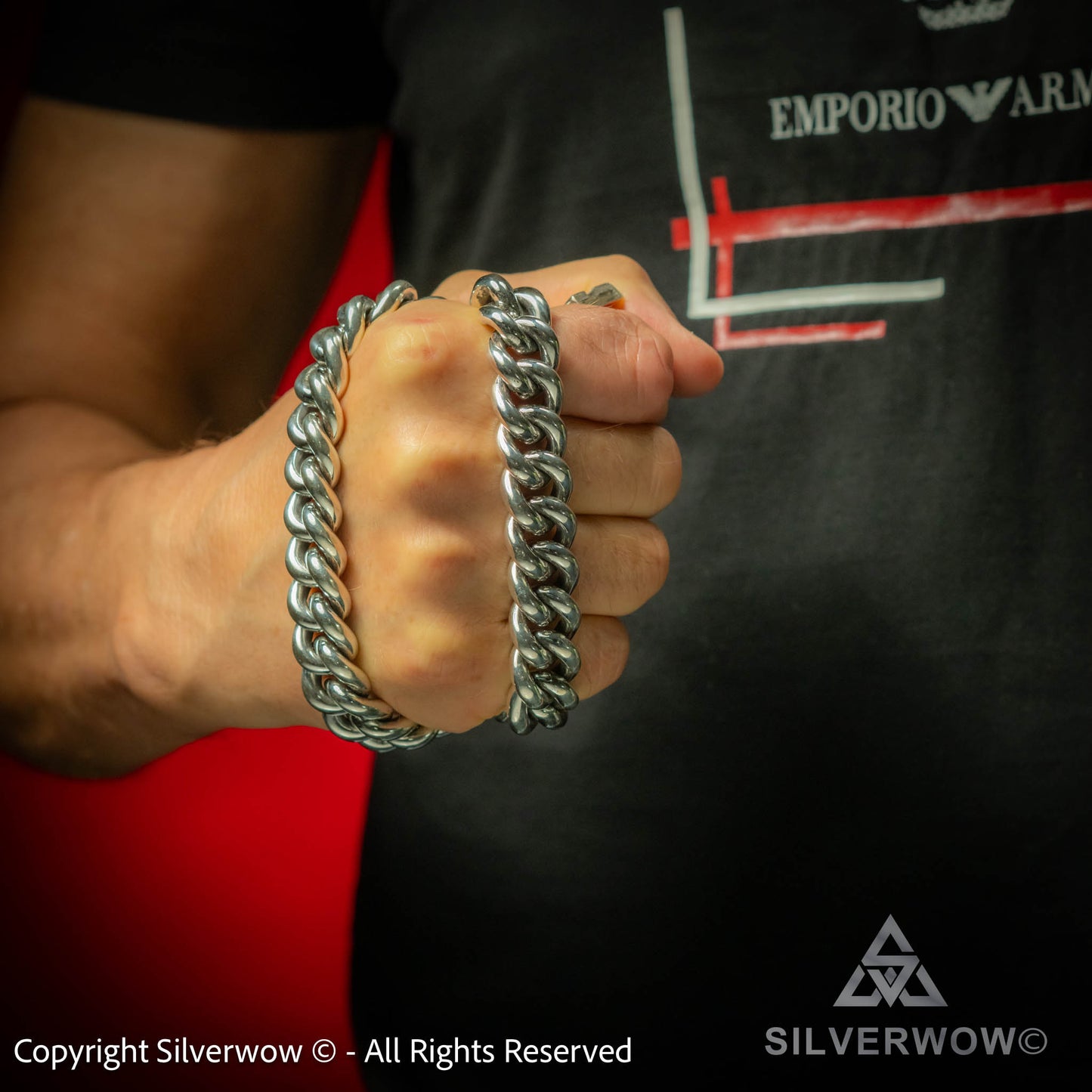 Thick rounded Cuban chain necklace in heavy silver – powerful men's design held in hand