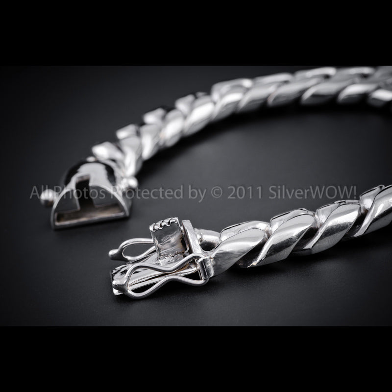 Rounded 15mm Cuban link bracelet laid flat with clasp open