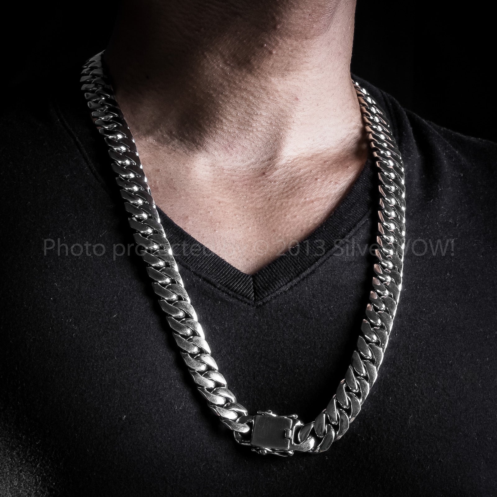 Close-up of 15mm silver curb chain necklace worn with relaxed chest fit