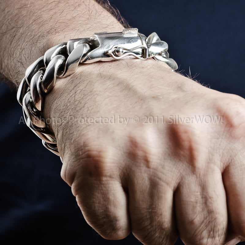 Chunky 20mm silver Cuban bracelet shown in hand - heavy design