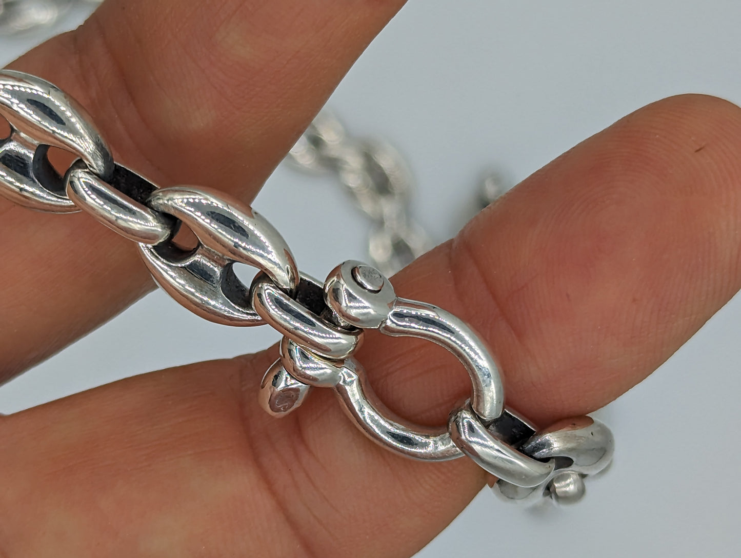12mm sterling silver mariner chain shown from above in hand
