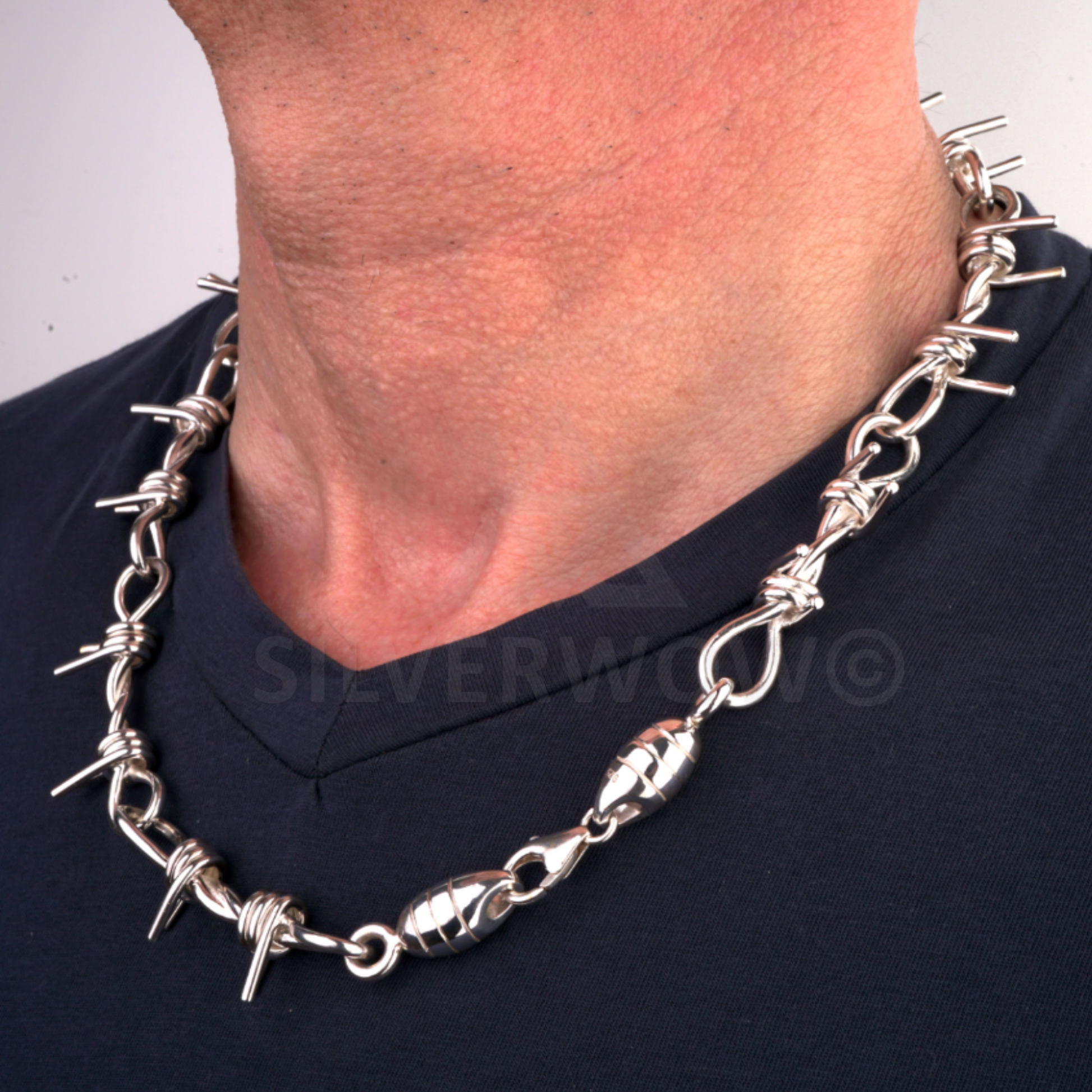 Barbed wire necklace in 925 silver worn on chest, unique handcrafted design for men