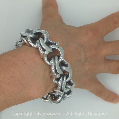 Solid silver Garibaldi bracelet worn on wrist, side profile