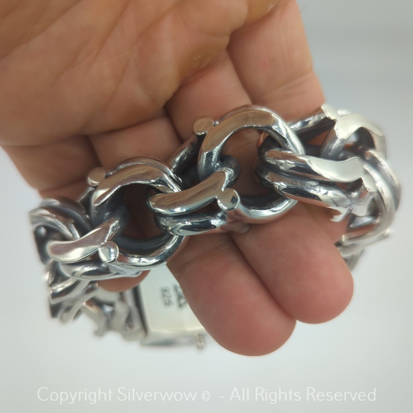 Closeup of Bismarck link clasp on sterling silver bracelet