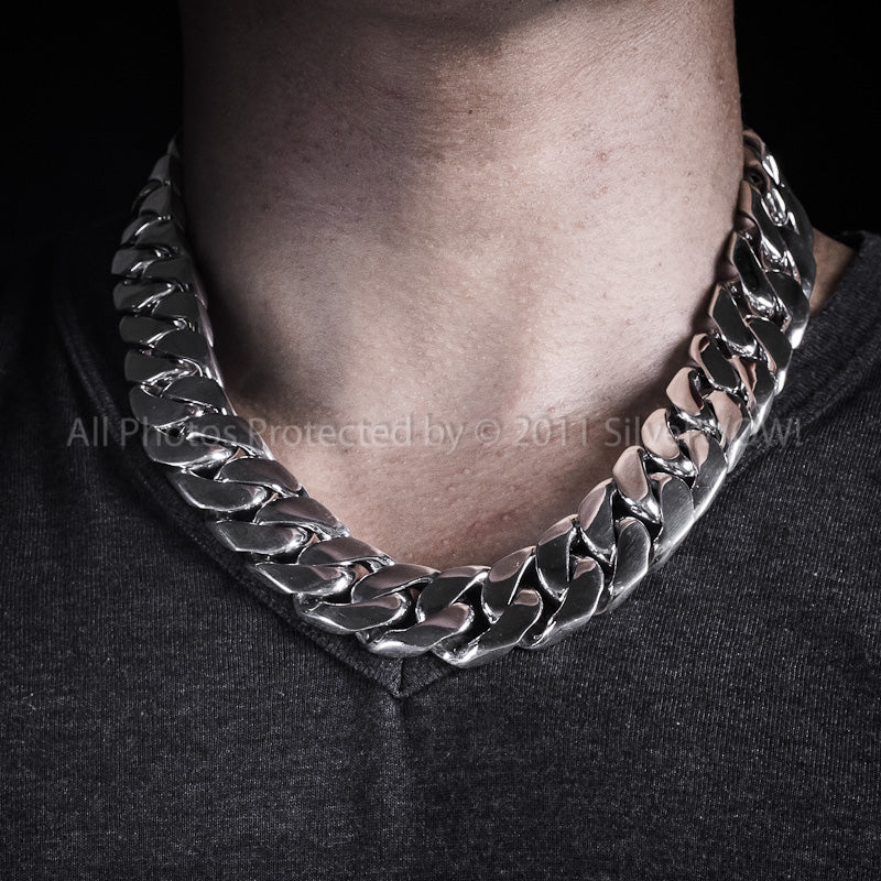 20mm silver cuban chain necklace worn tight around the neck with chunky solid links