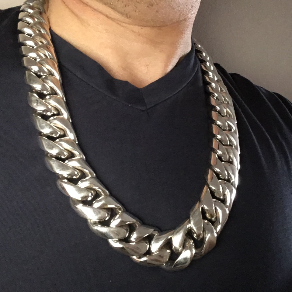 Chunky 925 silver Cuban link necklace worn with v-neck

