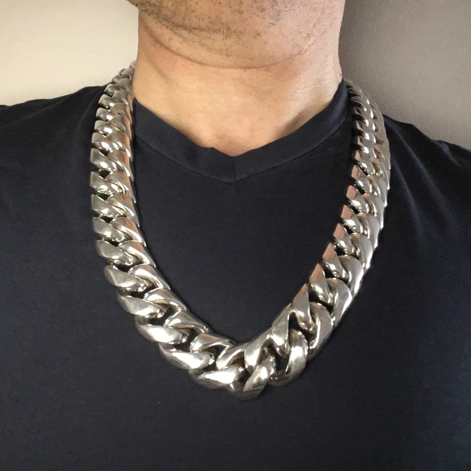 Chunky 925 silver Cuban link necklace worn with v-neck
